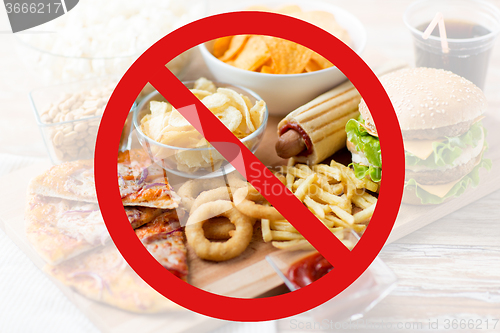 Image of close up of fast food snacks behind no symbol