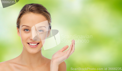 Image of smiling young woman face and shoulders