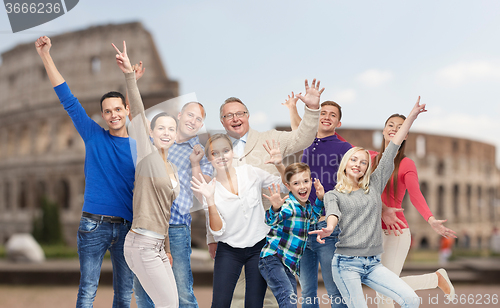 Image of group of happy people having fun over coliseum