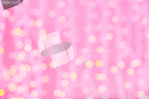 Image of pink blurred background with bokeh lights