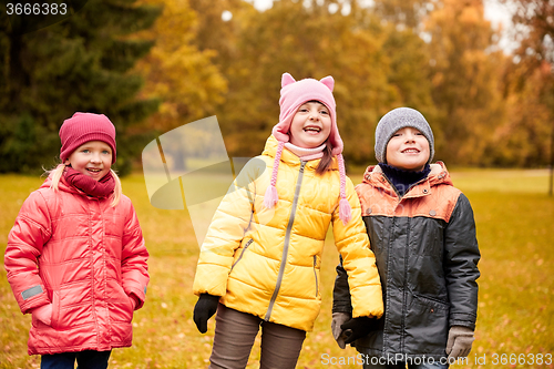 Image of group of happy children in autumn park