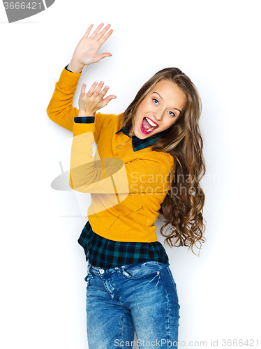 Image of happy young woman or teen girl applauding