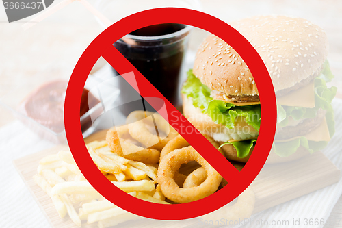 Image of close up of fast food and drink behind no symbol