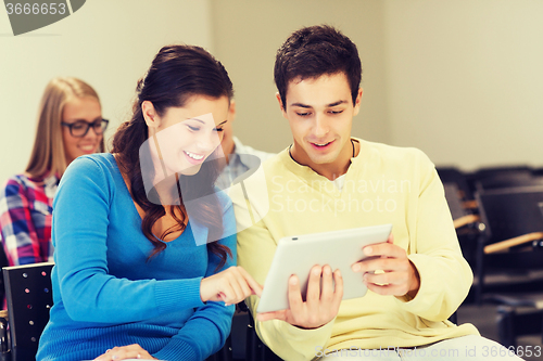 Image of group of smiling students with tablet pc