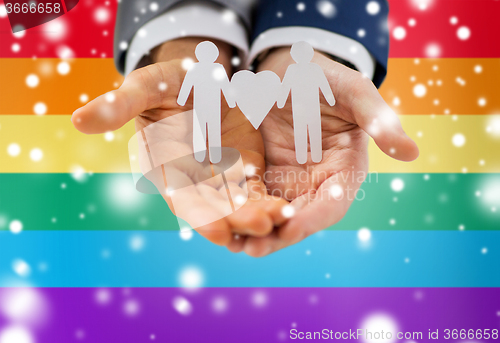 Image of close up of happy male gay couple with love symbol