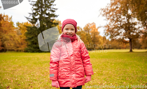 Image of happy little girl in autumn park