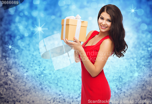 Image of beautiful sexy woman in red dress with gift box