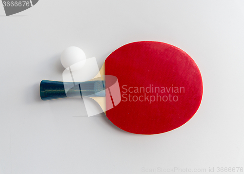 Image of close up of table tennis rackets with ball