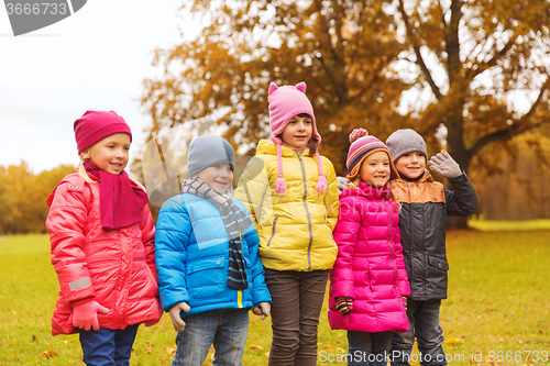 Image of group of happy children in autumn park
