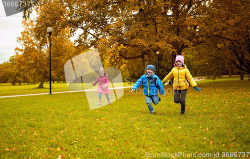 Image of group of happy little kids running outdoors