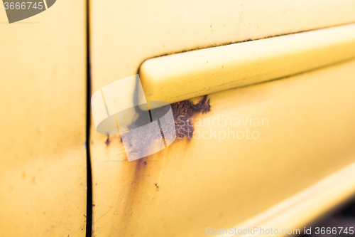 Image of close up of rusty car door surface