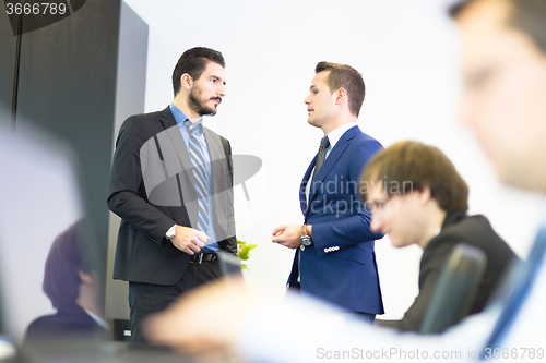 Image of Business people in modern office.