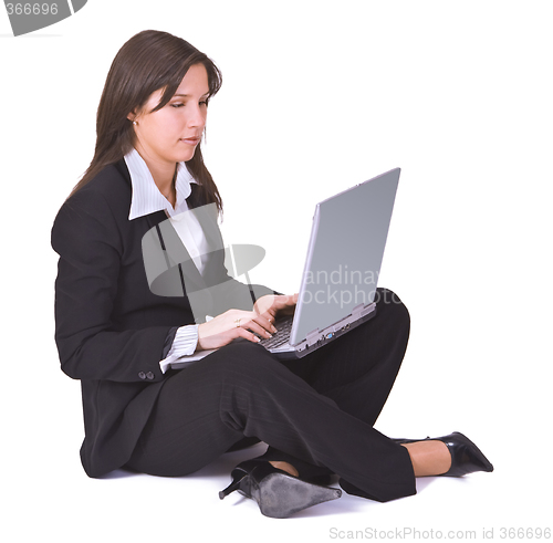 Image of Businesswoman working on a laptop