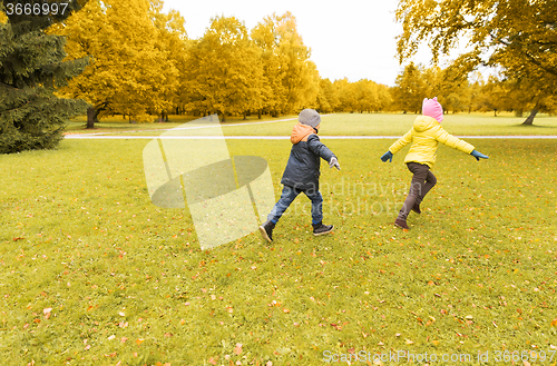 Image of group of happy little kids running outdoors