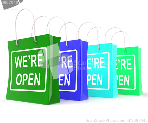 Image of We\'re Open Shopping Bags Shows New Store Launch