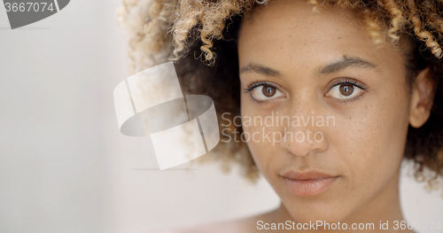 Image of Girl Putting Make Up On Lips