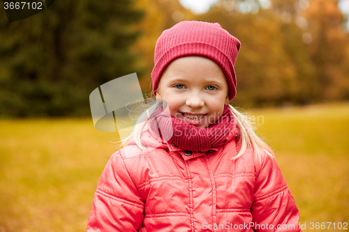 Image of happy little girl in autumn park