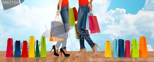 Image of close up of women with shopping bags