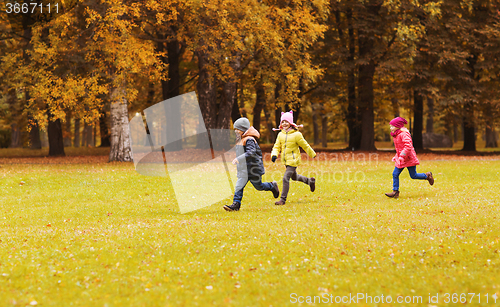 Image of group of happy little kids running outdoors