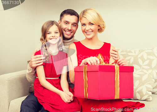 Image of happy family opening gift box