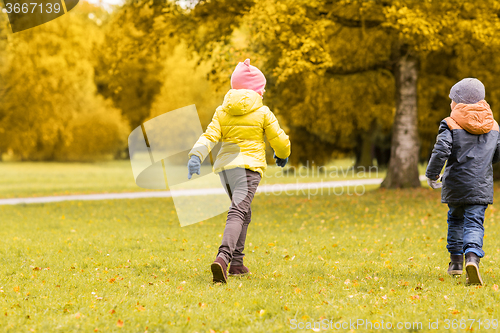 Image of group of happy little kids running outdoors