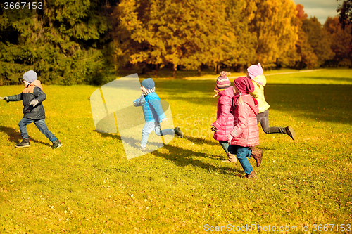Image of group of happy little kids running outdoors
