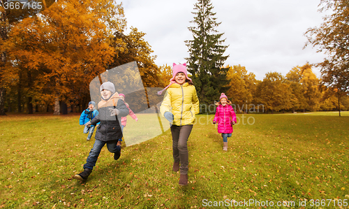 Image of group of happy little kids running outdoors