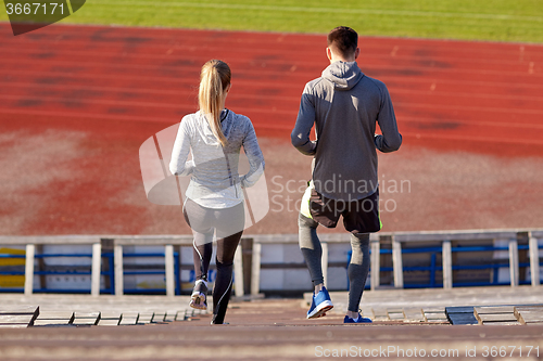 Image of couple walking downstairs on stadium