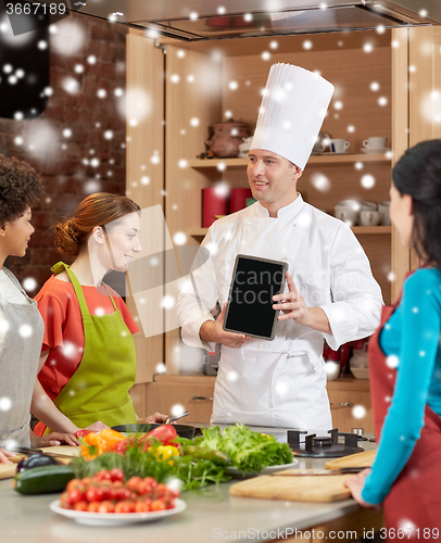 Image of happy women with chef and tablet pc in kitchen