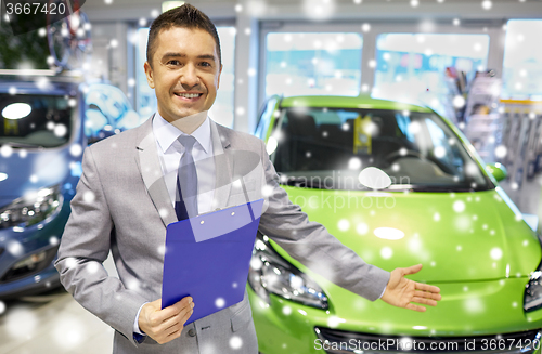 Image of happy man at auto show or car salon