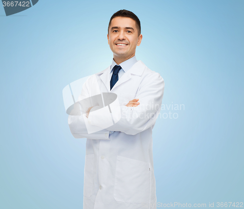 Image of smiling male doctor in white coat