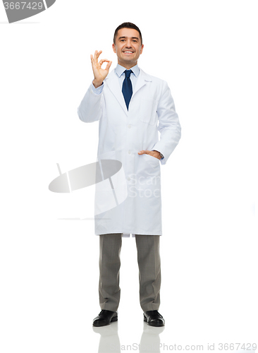 Image of smiling doctor in white coat showing ok hand sign