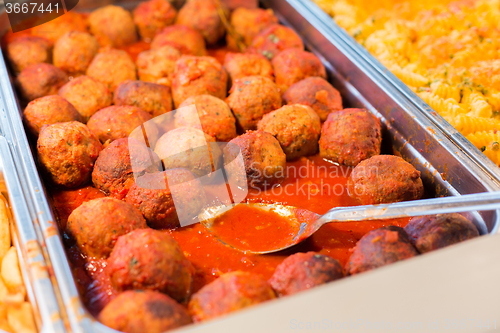 Image of close up of meatballs and other dishes on tray