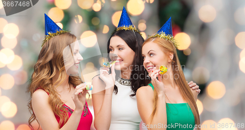 Image of smiling women holding glasses of sparkling wine