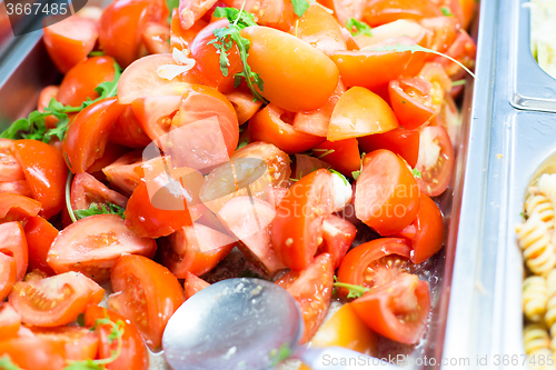 Image of close up of tomato salad in container