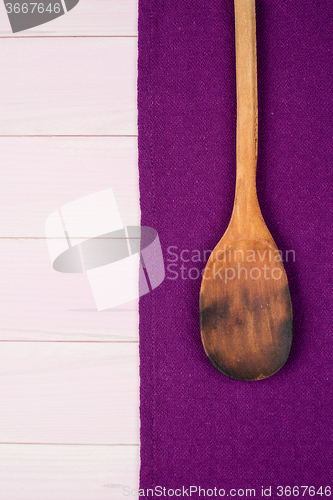 Image of Kitchenware on purple towel