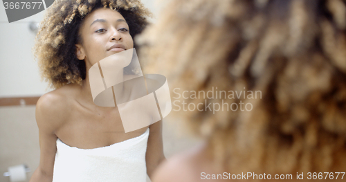 Image of Woman In Front Of The Mirror