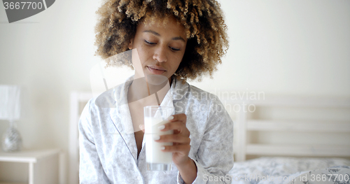 Image of Woman Drinking A Milk On Bed