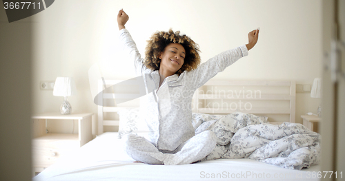 Image of Young Woman Awaking On The Bed