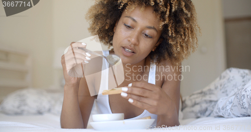 Image of Woman Enjoying Breakfast In Bed