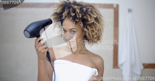 Image of Woman Drying Her Hair With Hairdryer
