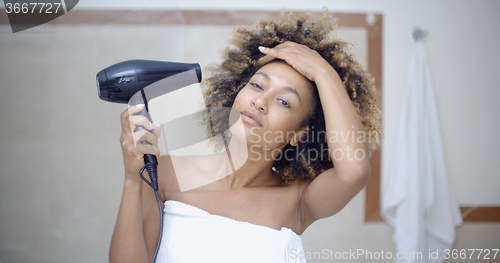 Image of Woman Drying Her Hair With Hairdryer