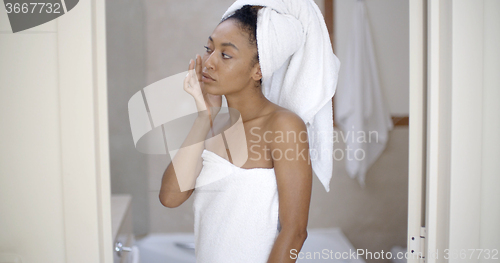 Image of Woman Looking On The Mirror After Shower