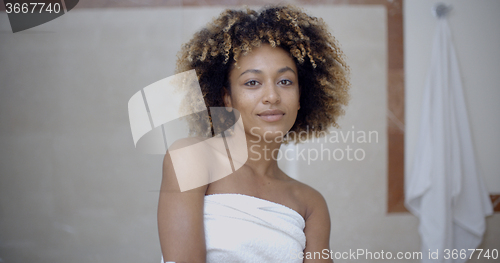 Image of Woman Covering Her Body With Towel