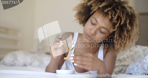 Image of Woman Enjoying Breakfast In Bed