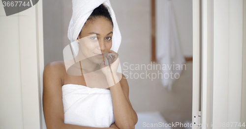 Image of Young Woman Wrapped In Towels