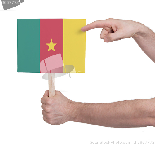 Image of Hand holding small card - Flag of Cameroon