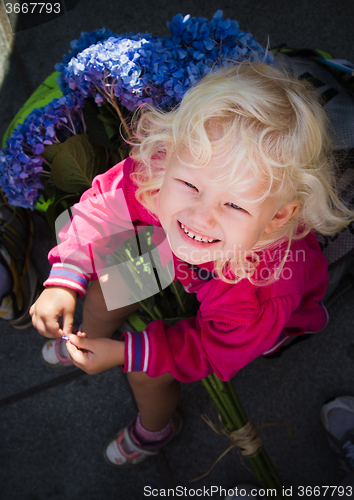 Image of Portrait of a little girl facing upward, close-up  