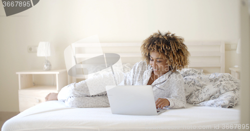 Image of Girl Surfing On The Internet At Home