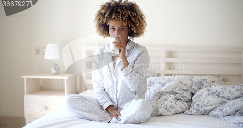 Image of Woman Drinking A Milk On Bed